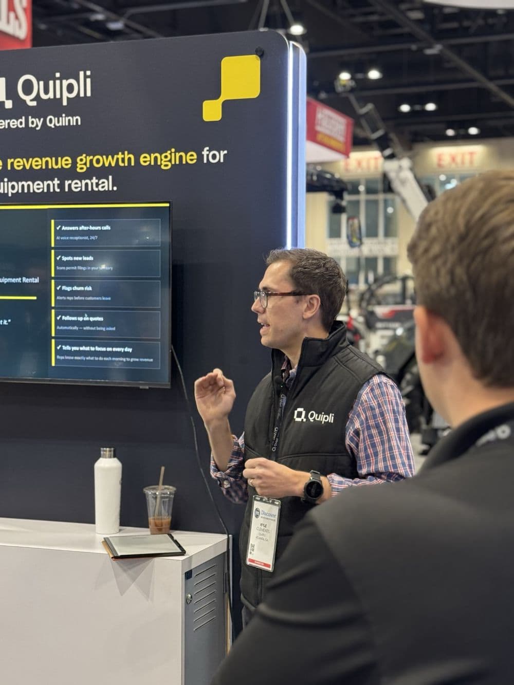A Quipli teammate demoing Quinn at the Quipli booth